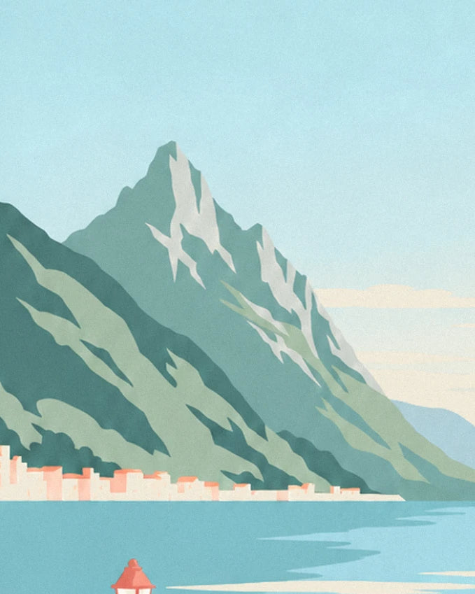 The rocky peak and its green slopes plunging into the lake, with a pink village at the foot