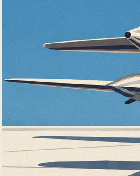 The cream and midnight blue wings of 2 planes on the pale tarmac, with long shadows on the ground