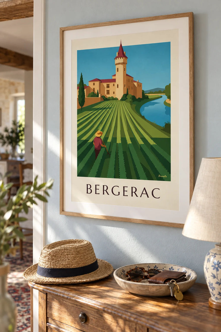 Poster of a round-towered castle and the vineyards of Bergerac: framed on the wall