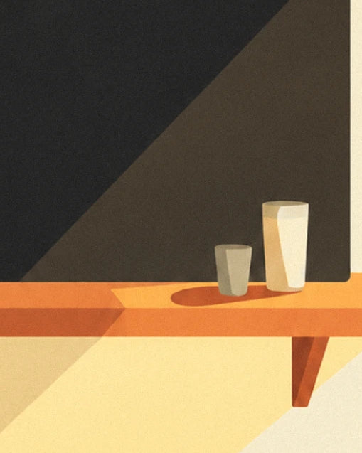 A small grey tumbler and a tall cream glass on the orange shelf, in front of the black chalkboard