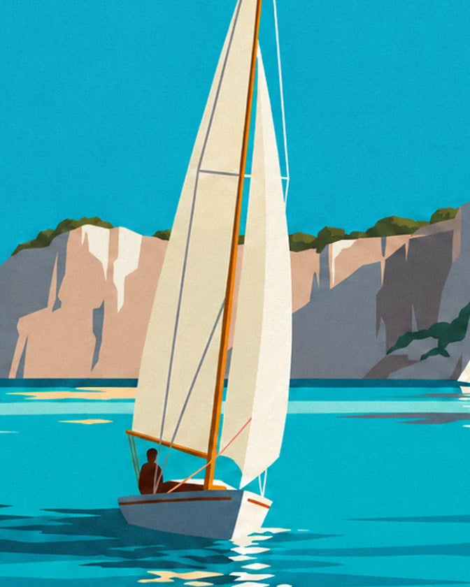 The sailing boat with a cream mainsail and its helmsman, in front of the beige cliffs
