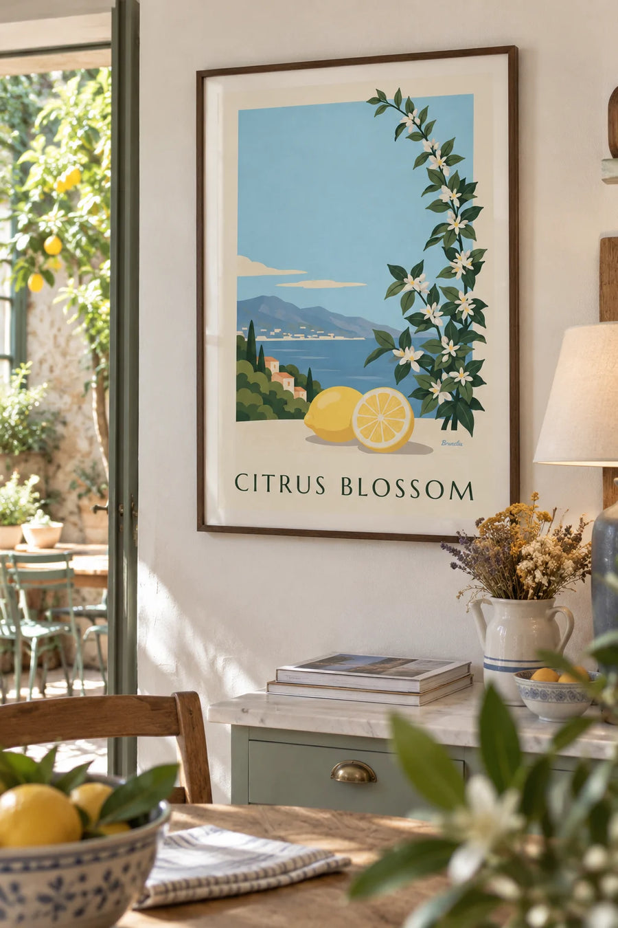 Poster of a lemon, a half lemon and white lemon blossoms: framed on the wall