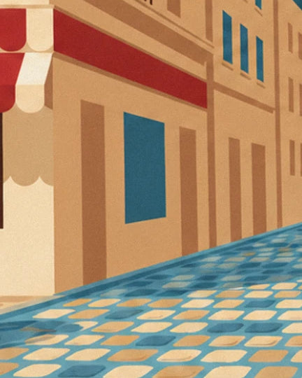 Una facciata ocra con finestre blu, una tenda rossa e crema e ciottoli blu e color sabbia