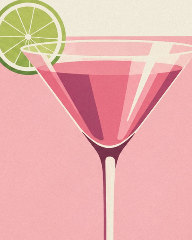 The pink cocktail glass with its lime slice against a soft pastel background