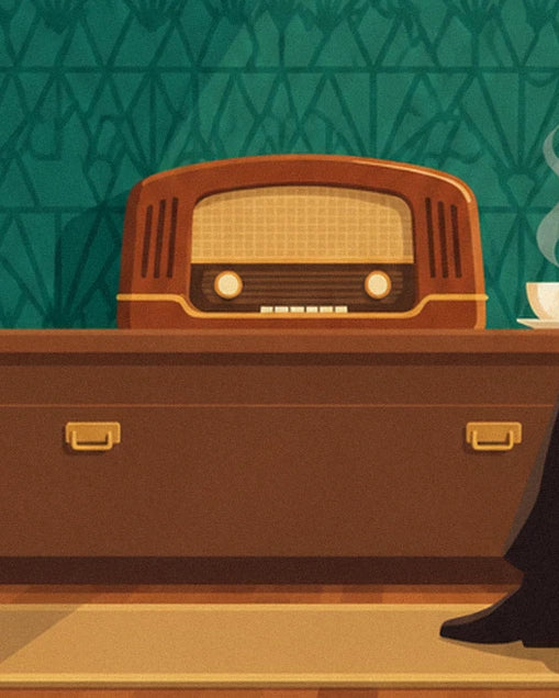 A wooden radio with golden knobs, sitting on a chest of drawers