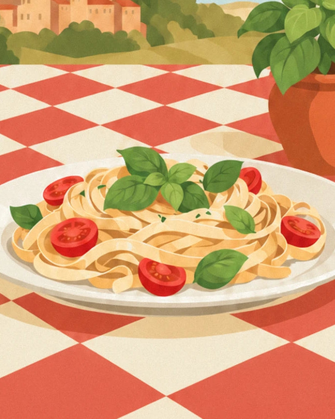 Un piatto di tagliatelle con basilico e pomodorini, sulla tovaglia a quadri rossa