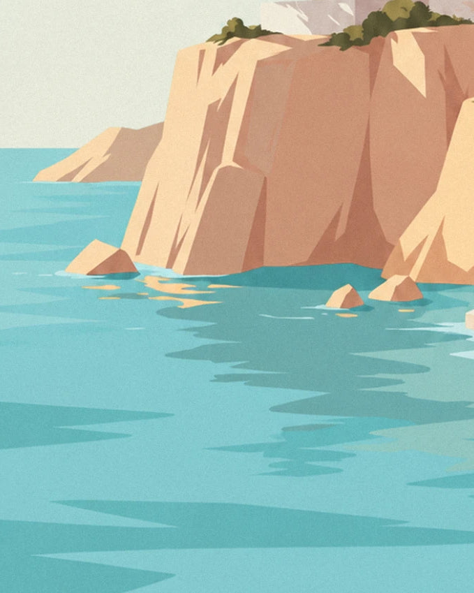 The ochre cliff plunging into a turquoise sea, with rocks and golden reflections