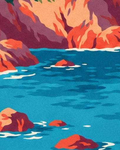 Orange rocks in the turquoise water, edged with foam at the foot of the cliffs