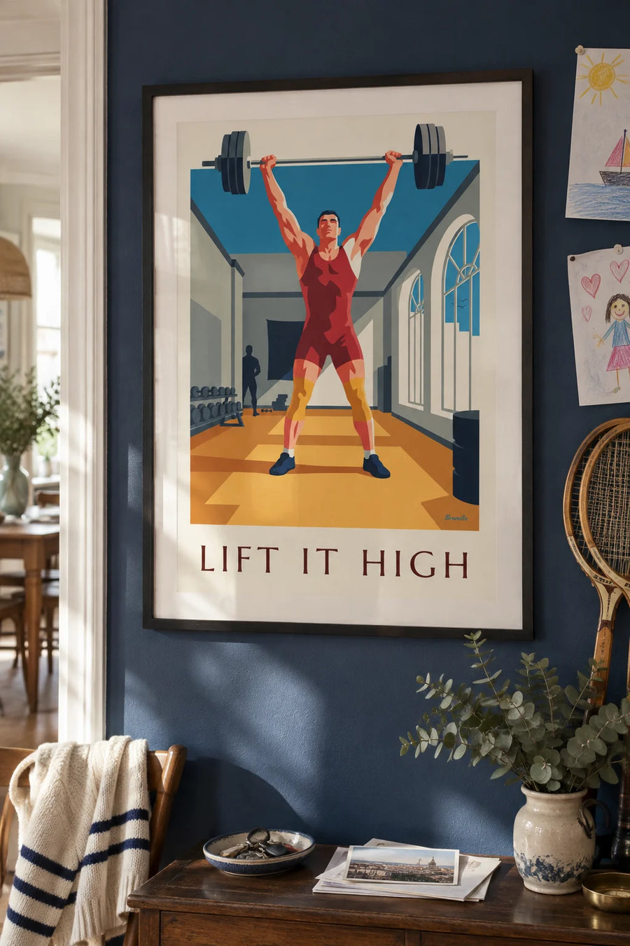 Poster of a weightlifter lifting a barbell in a gym: framed on the wall