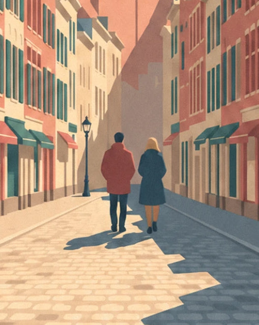A couple seen from behind on the sunlit cobbles, a black street lamp at the edge of the street