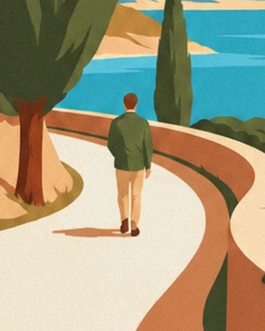 A man seen from behind in a green jacket on the curving road, between cypresses and turquoise sea