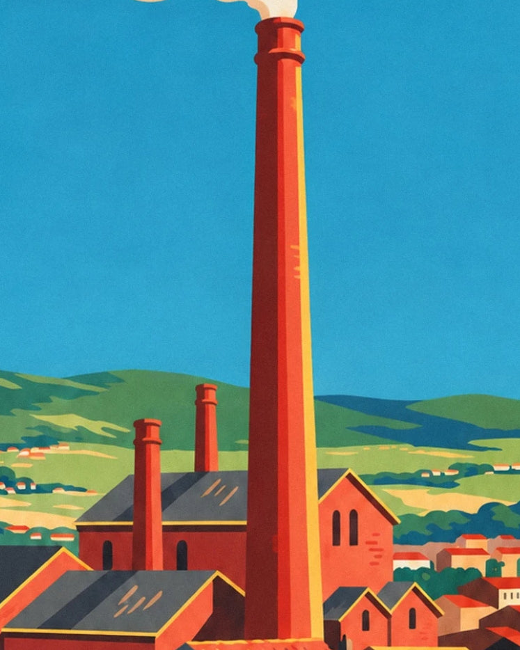 Le alte ciminiere rosse delle fabbriche di Mulhouse davanti a uno sfondo di colline verdi