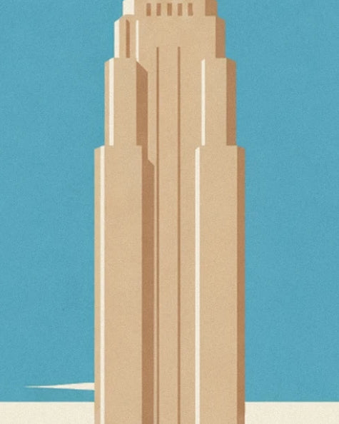 A slender beige tower against the blue sky of Manhattan