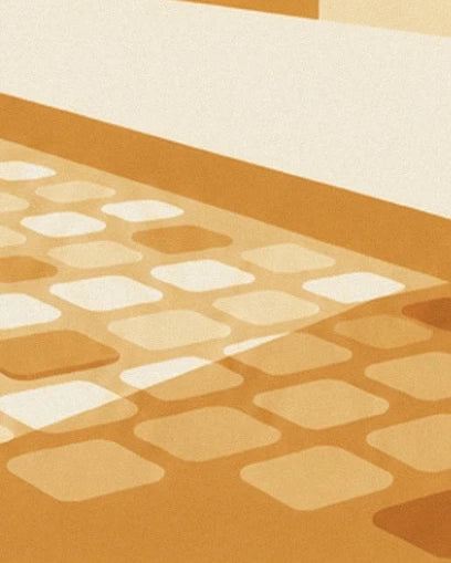Les pavés crème et ocre de la rue, au pied du trottoir clair