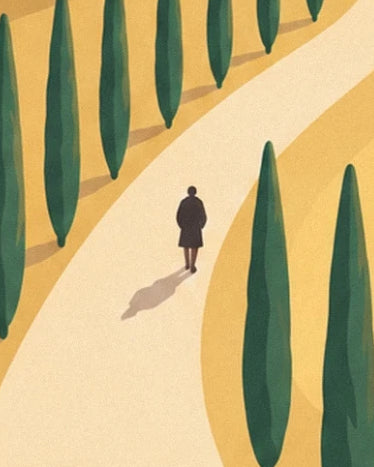 A dark figure and their shadow on a pale path lined with cypress trees
