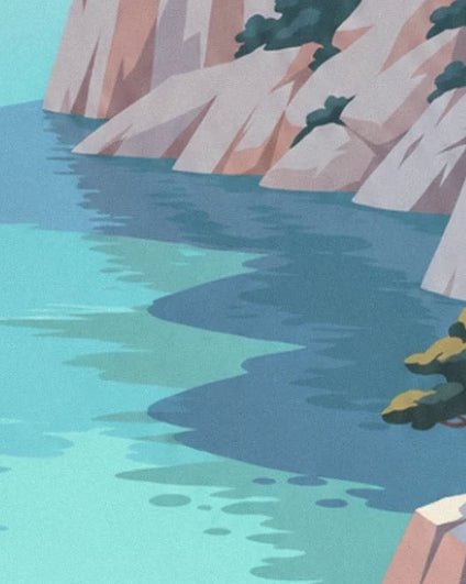 The blue-tinged shadows of the cliffs on the turquoise waters of the cove