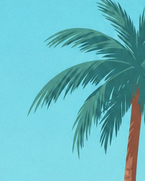 The long green fronds of a palm tree against a turquoise-blue background