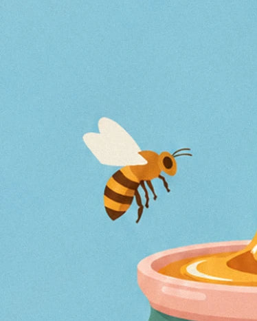 A striped bee flying in the blue sky near the rim of the honey pot