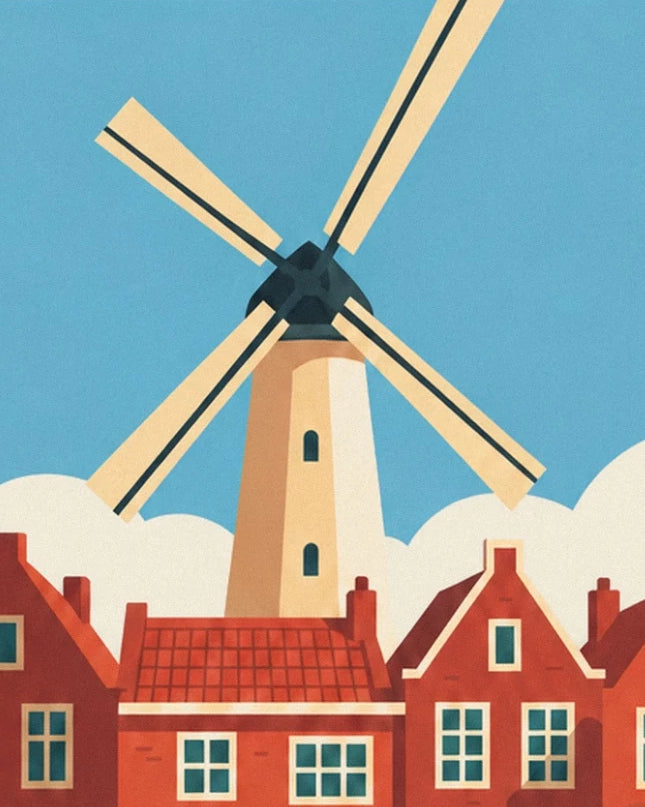 Le moulin aux ailes crème au-dessus des maisons hollandaises aux toits rouges