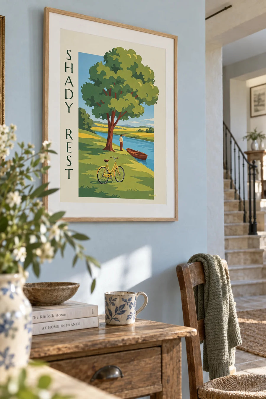 Poster of a bicycle in the shade of a tree by the river: framed on the wall