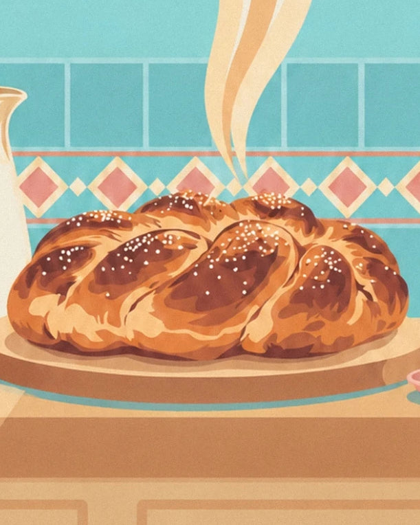 The golden plaited brioche with pearl sugar on its board, in front of the turquoise tiles