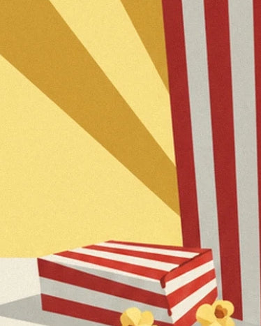 La scatola bassa a righe rosse e bianche davanti al grande cono, con dei pezzi di popcorn