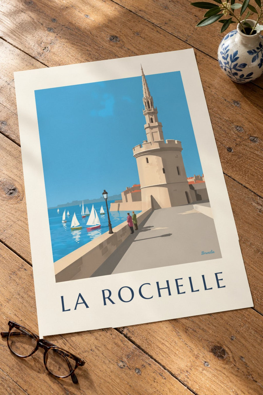 Affiche della Torre della Lanterna a La Rochelle : appoggiato su un tavolo