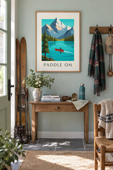 Poster of a canoe on an alpine lake and snow-capped mountains: framed on the wall