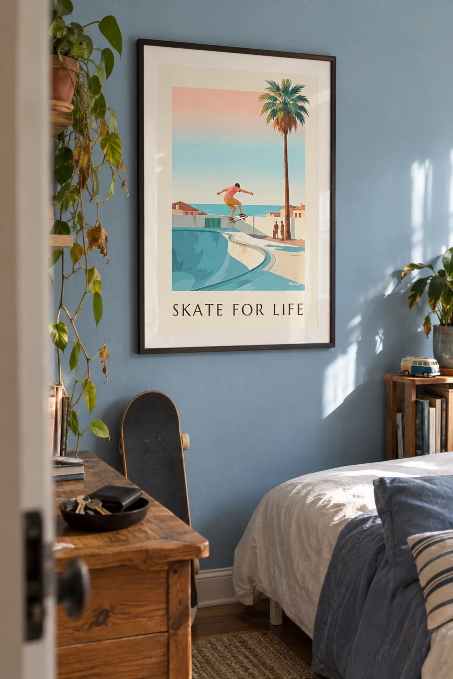 Poster of a skater mid-jump above a bowl: framed on the wall