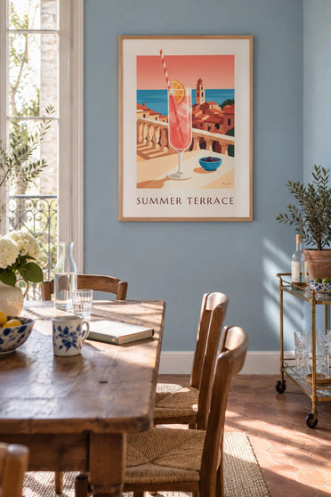Poster of a rosé summer cocktail on a terrace facing the sea: framed on the wall